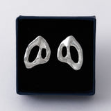 KEYES-spaced-earrings-Space-ghost-sculptural-hammered-handmade-statement-cut-out-stud-earrings-design-cool-unique-jewellery-demifine-independent-london