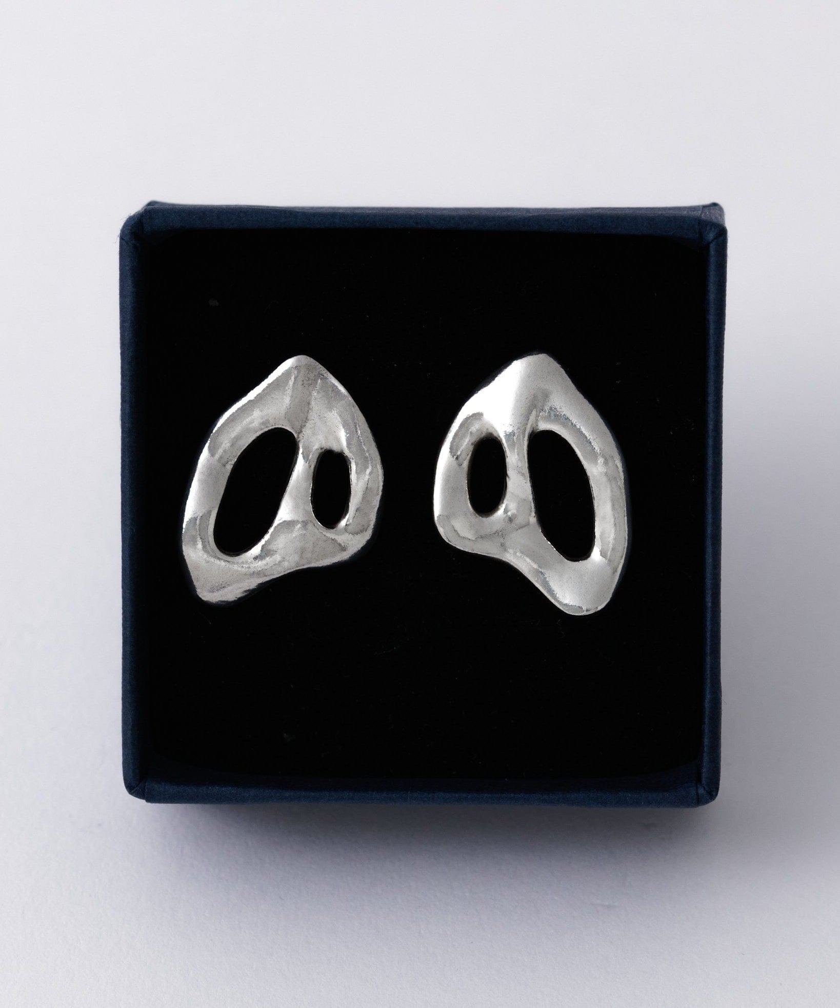 KEYES-spaced-earrings-Space-ghost-sculptural-hammered-handmade-statement-cut-out-stud-earrings-design-cool-unique-jewellery-demifine-independent-london