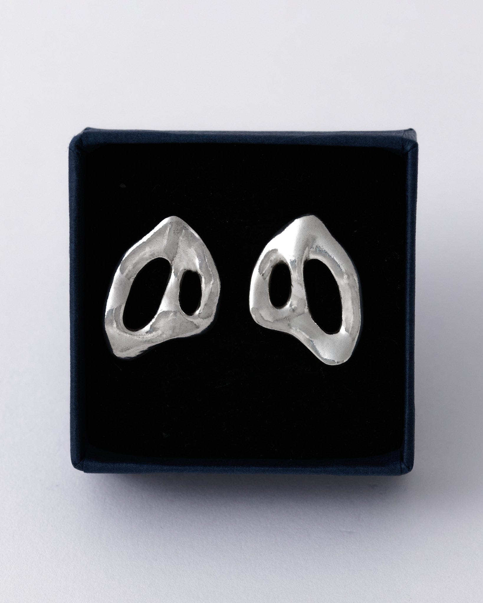KEYES-spaced-earrings-Space-ghost-sculptural-hammered-handmade-statement-cut-out-stud-earrings-design-cool-unique-jewellery-demifine-independent-london