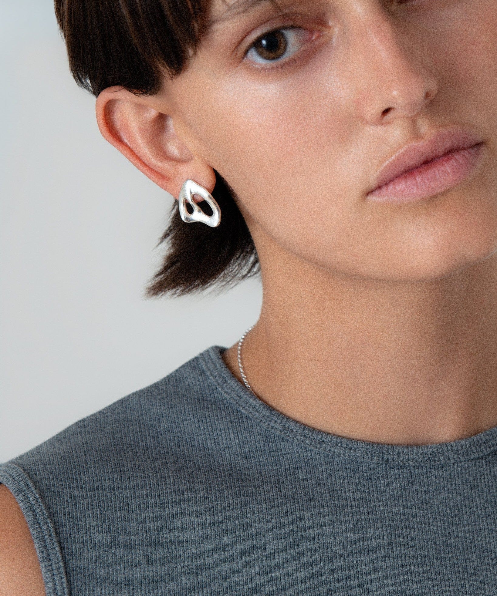 KEYES-spaced-earrings-Space-ghost-sculptural-hammered-handmade-statement-cut-out-stud-earrings-design-cool-unique-jewellery-demifine-independent-london2