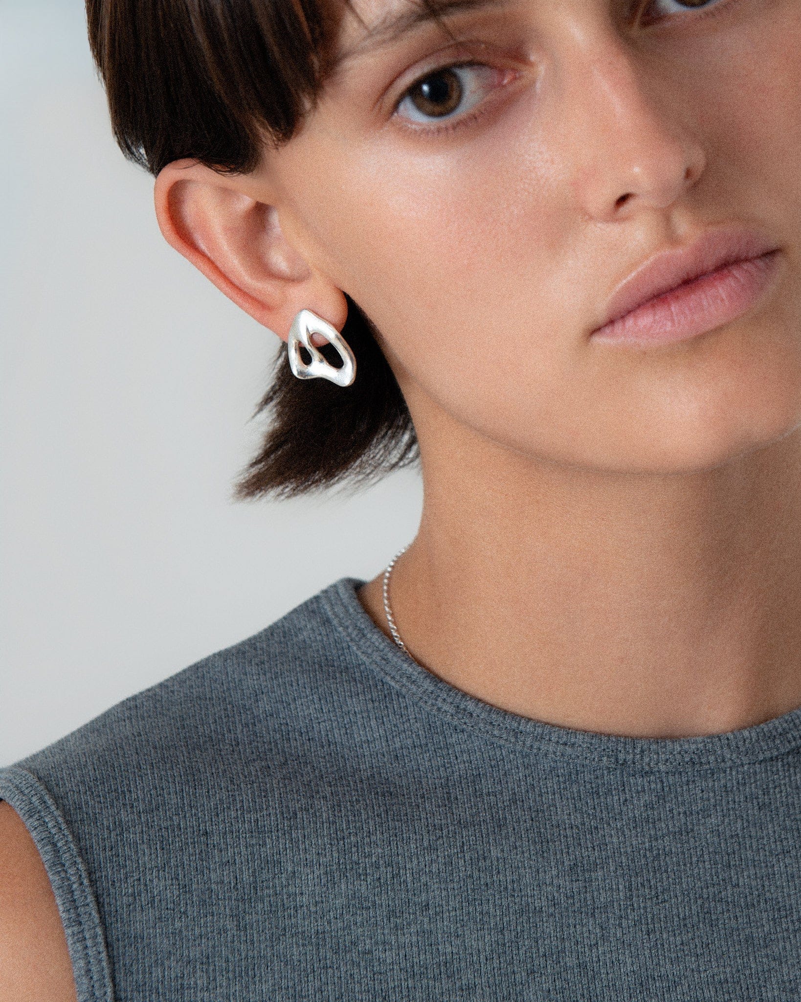 KEYES-spaced-earrings-Space-ghost-sculptural-hammered-handmade-statement-cut-out-stud-earrings-design-cool-unique-jewellery-demifine-independent-london2
