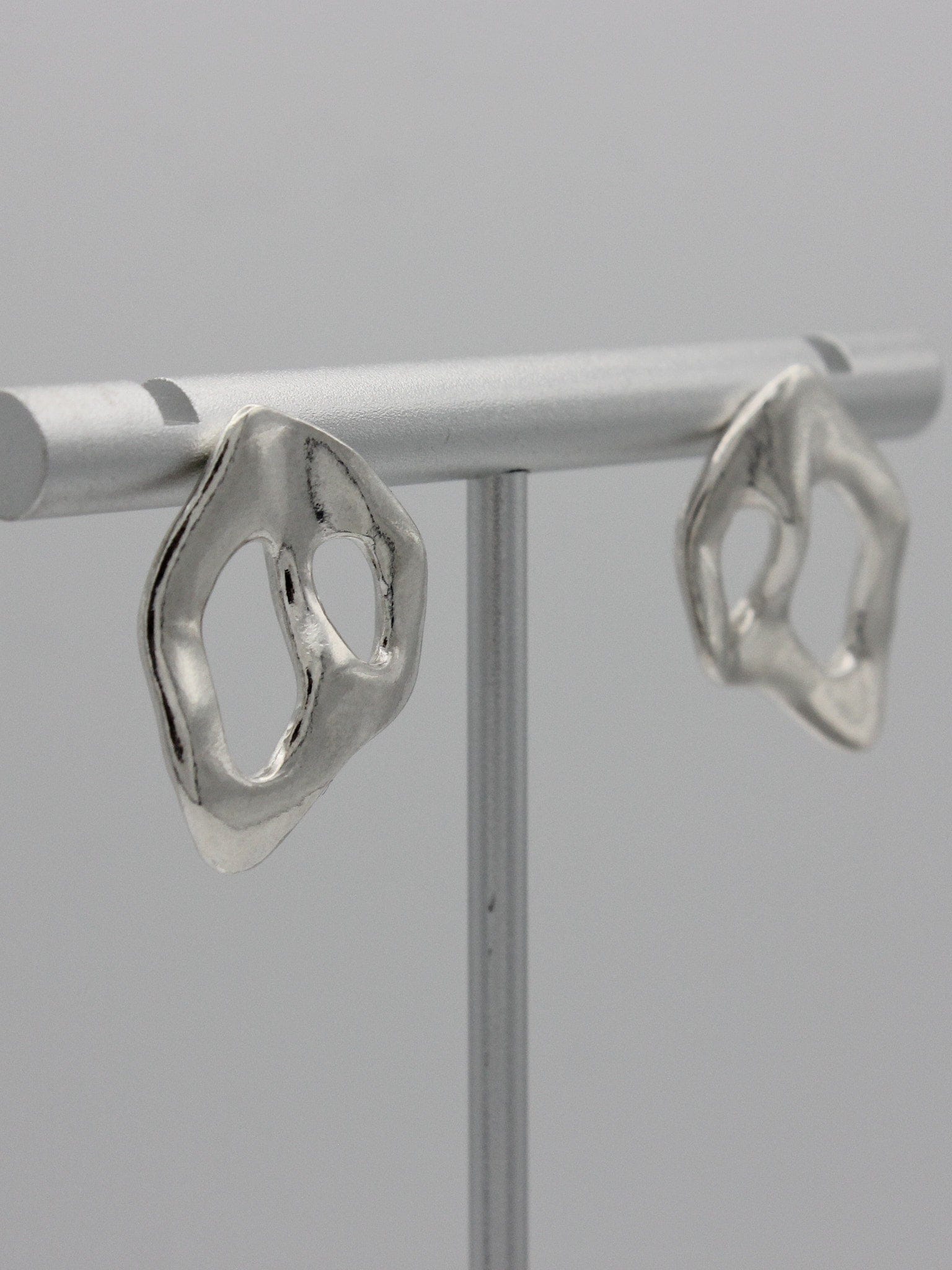 KEYES-spaced-earrings-Space-ghost-sculptural-hammered-handmade-statement-cut-out-stud-earrings-design-cool-unique-jewellery-demifine-independent-london
