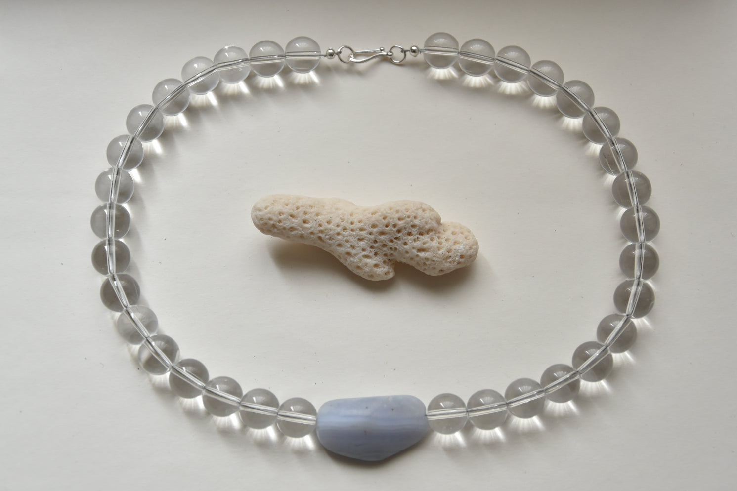 Kan-Studio-Aria-Necklace-Blue-Lace-Agate-stunning-chunky-transparent-clear-glass-beaded-beadnecklace-pale-sky-blue-lace-agate-stone-pendant-Statement-soft-colour-tones-day-evening-cool-london-handmade