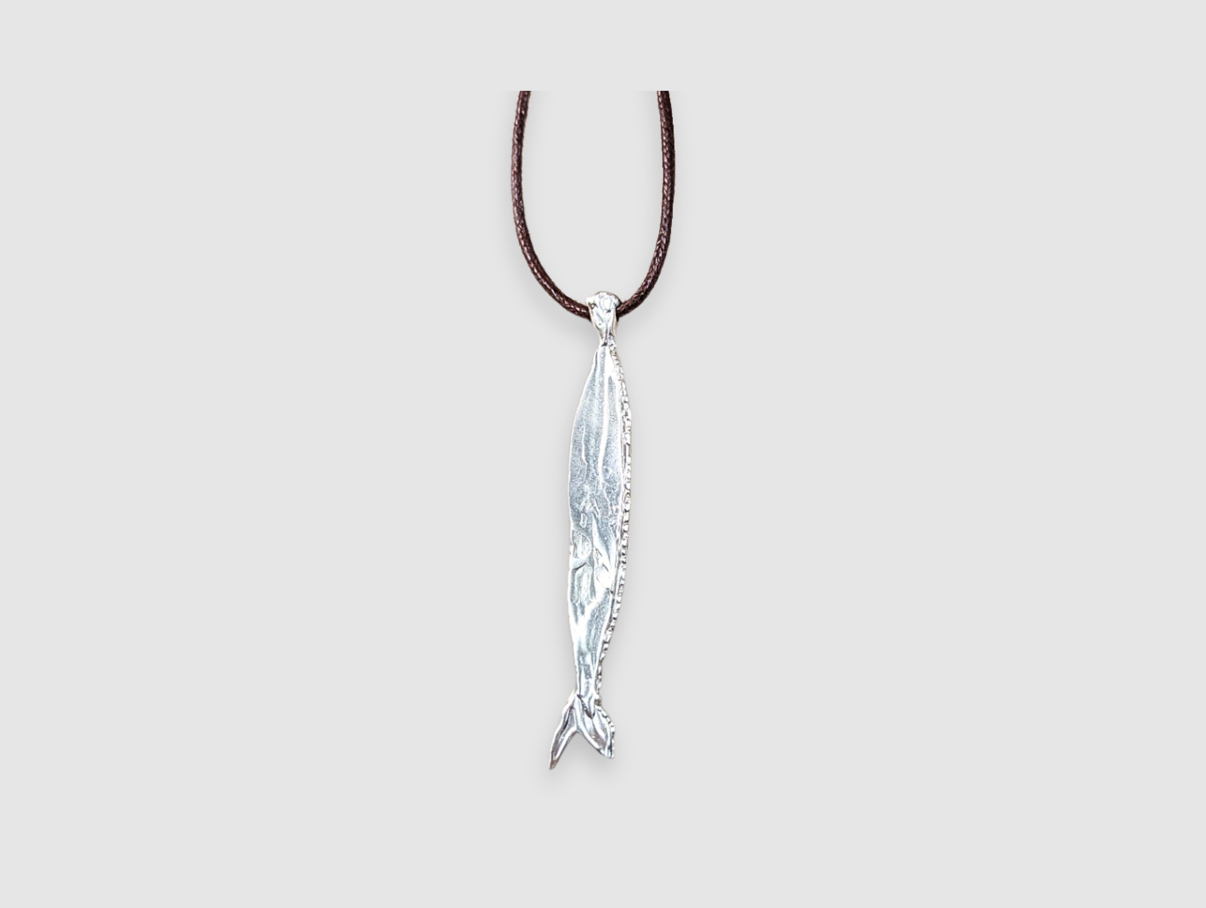 Milly-Maunder-Fish-Pendant-Long-Brown-Cord-Rope-2026-Trends-Necklace-Coastal-Marine-Motifs-Jewellery-Beach-Summer-Pendant-Sealife-Ocean-Textured-Cool-Pisces-Sterling-Silver