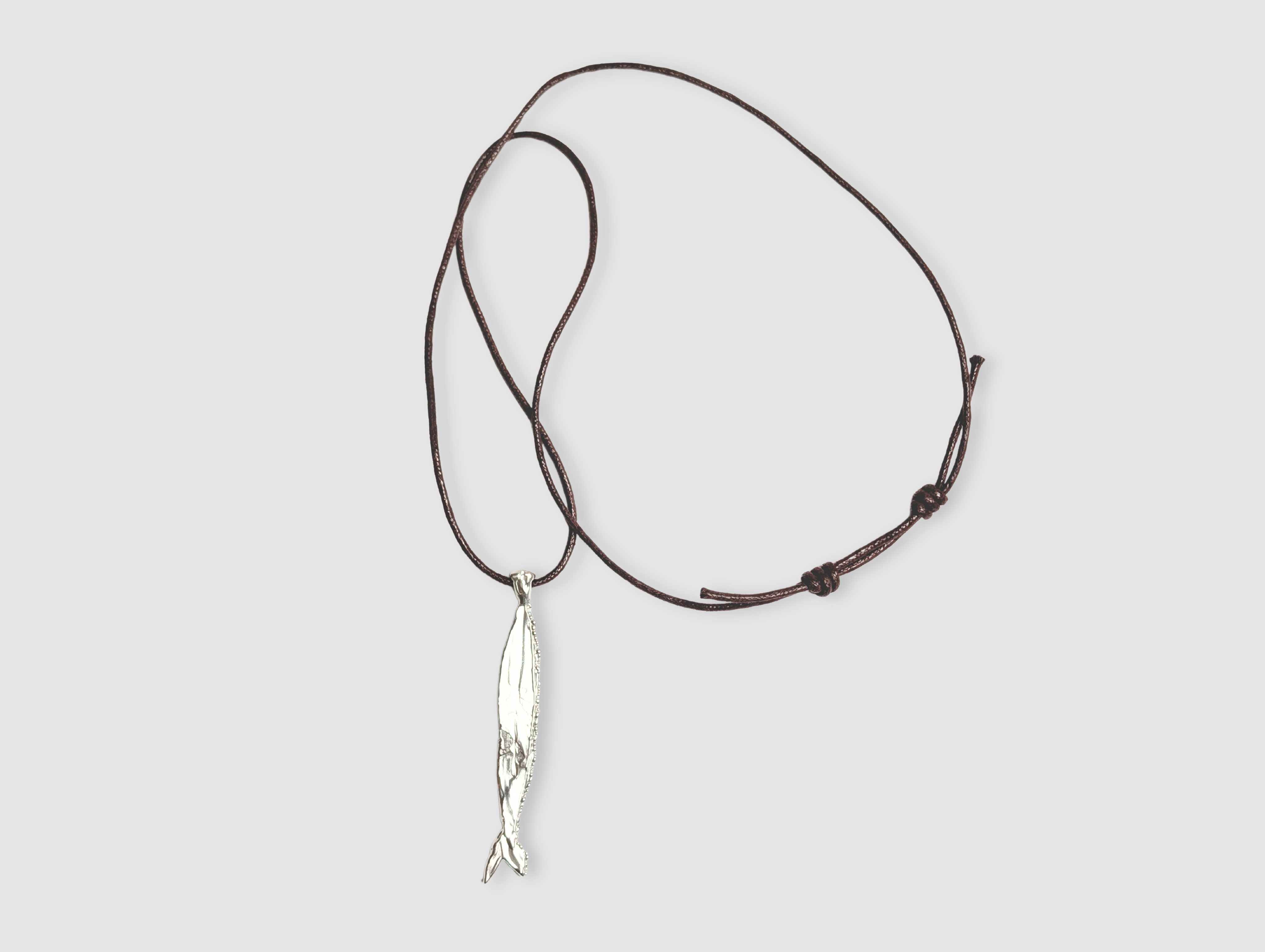 Milly-Maunder-Fish-Pendant-Long-Brown-Cord-Rope-2026-Trends-Necklace-Coastal-Marine-Motifs-Jewellery-Beach-Summer-Pendant-Sealife-Ocean-Textured-Cool-Pisces-Sterling-Silver