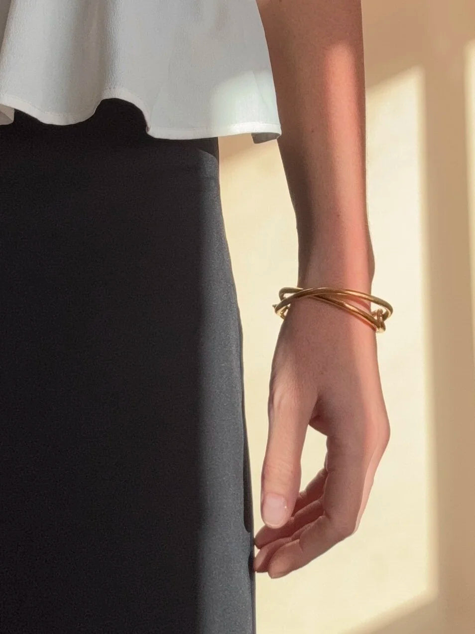 Ruddock-Soma-Bangle-Cuff-Interlocking-Interwoven-Tublar-Scultpural-twisted-clean-lines-forms-modern-statement-bracelet-Sleek-minimal-cool-jewellery-demifine-gold-plated-18ct