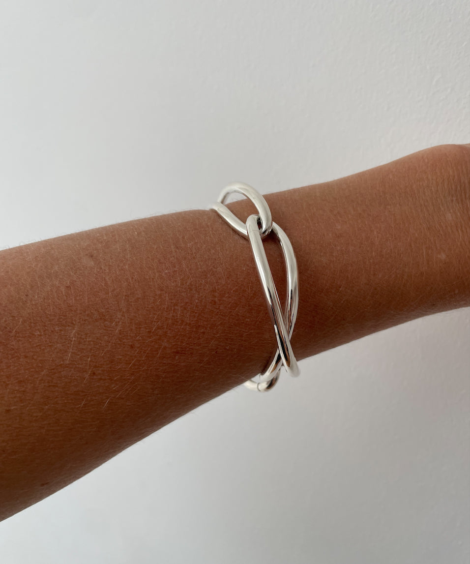 Ruddock-Soma-Bangle-Cuff-Interlocking-Interwoven-Tublar-Scultpural-twisted-clean-lines-forms-modern-statement-bracelet-Sleek-minimal-cool-jewellery-demifine-sterling-silver-solid