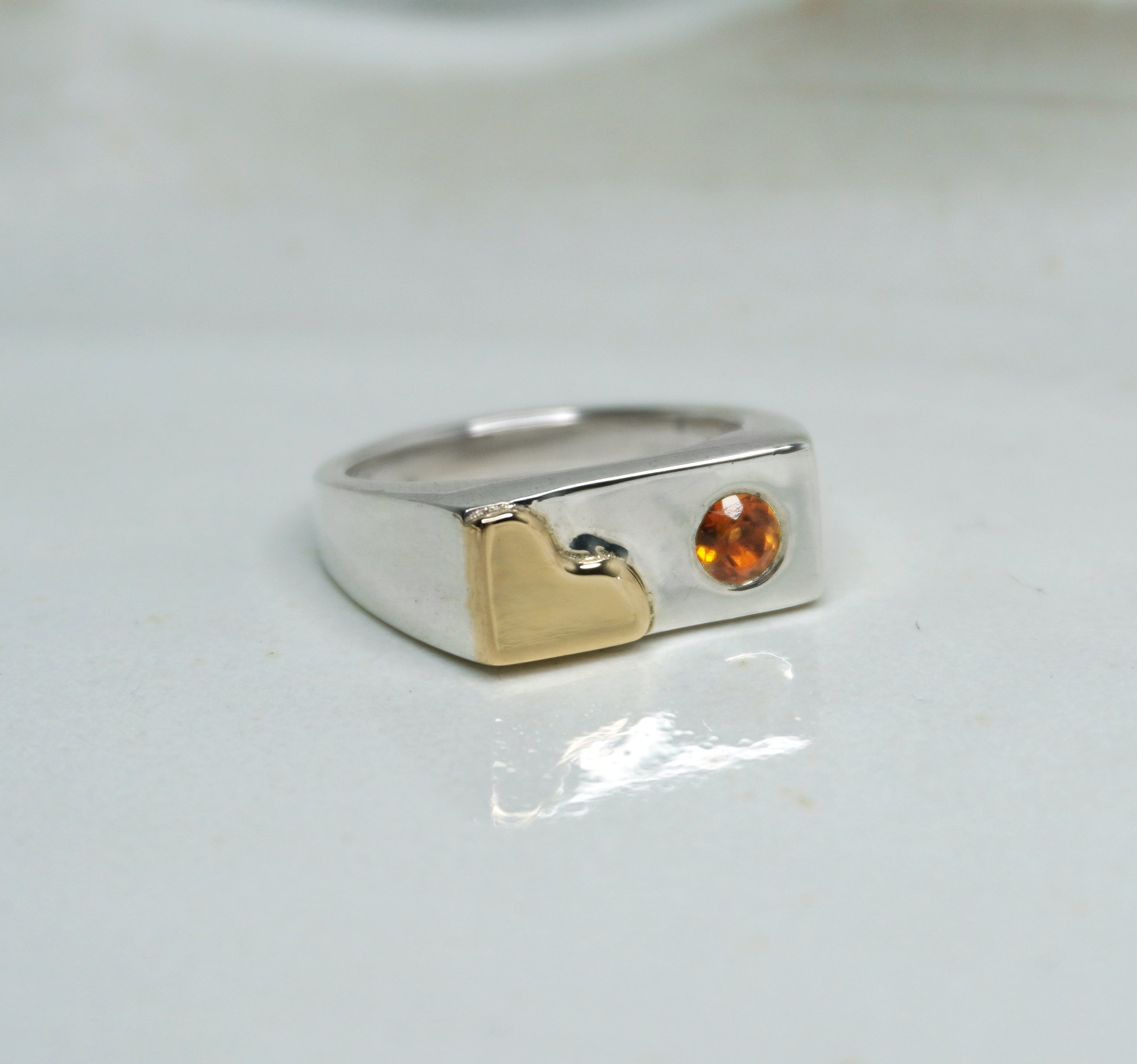 Tilly-Sudsbury-signet-ring-with-a-twist-orange-citrine-gemstone-rectangle-chunky-ring-statement-mixed-metal-gold-sterling-silver