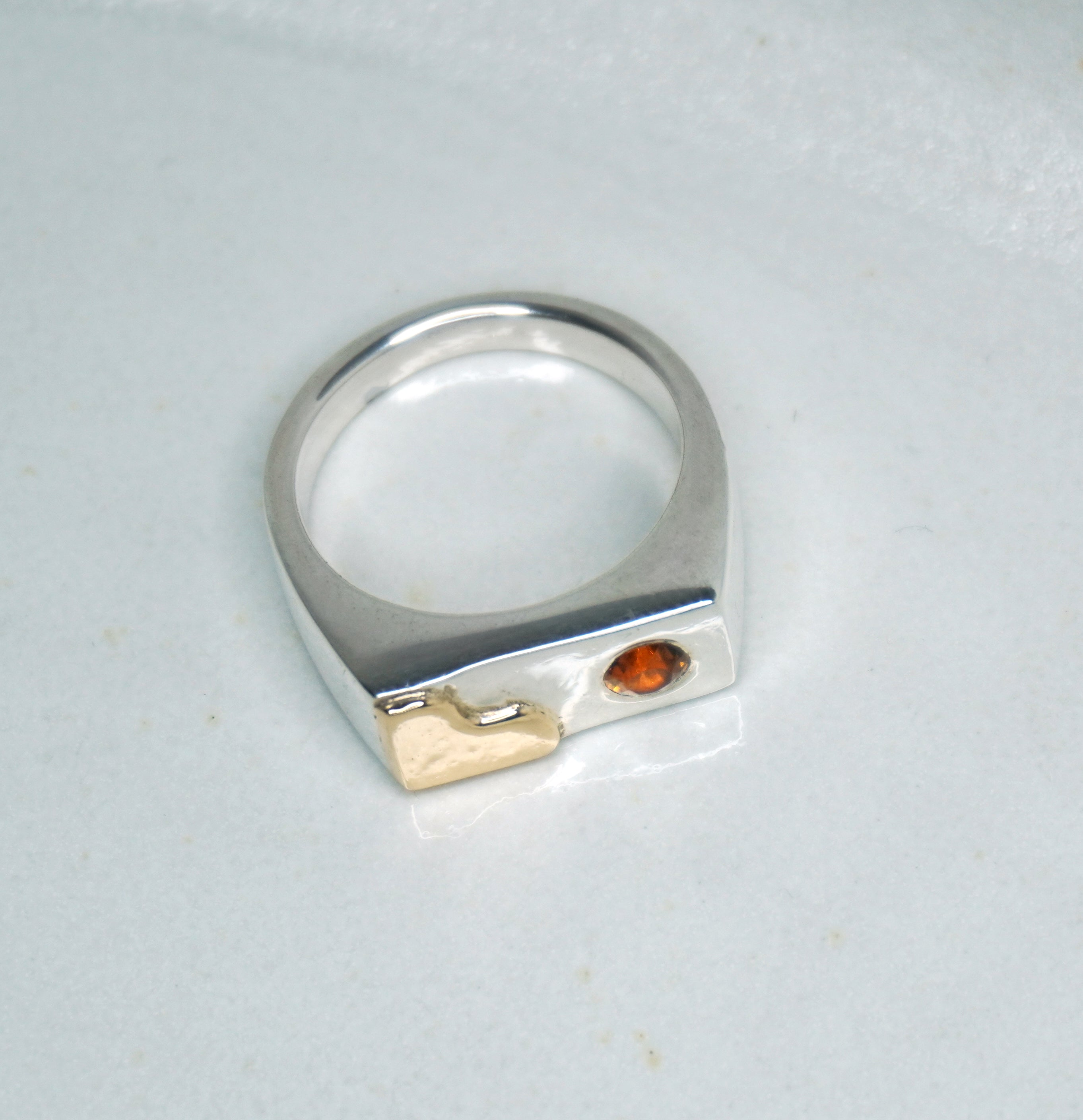 Tilly-Sudsbury-signet-ring-with-a-twist-orange-citrine-gemstone-rectangle-chunky-ring-statement-mixed-metal-gold-sterling-silver