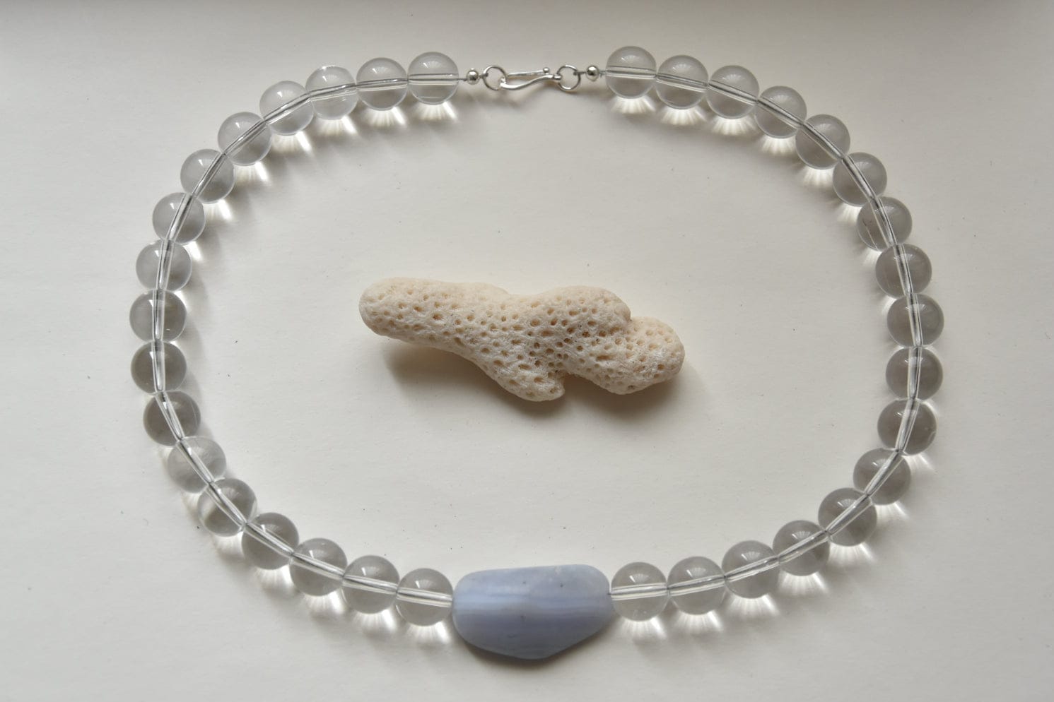 Kan-Studio-Aria-Necklace-Blue-Lace-Agate-stunning-chunky-transparent-clear-glass-beaded-beadnecklace-pale-sky-blue-lace-agate-stone-pendant-Statement-soft-colour-tones-day-evening-cool-london-handmade