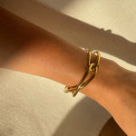 Ruddock-Soma-Bangle-Cuff-Interlocking-Interwoven-Tublar-Scultpural-twisted-clean-lines-forms-modern-statement-bracelet-Sleek-minimal-cool-jewellery-demifine-gold-plated-18ct