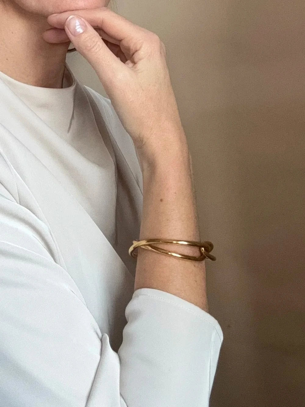 Ruddock-Soma-Bangle-Cuff-Interlocking-Interwoven-Tublar-Scultpural-twisted-clean-lines-forms-modern-statement-bracelet-Sleek-minimal-cool-jewellery-demifine-gold-plated-18ct
