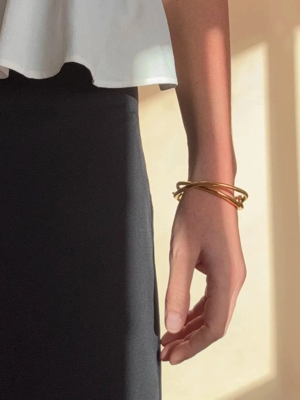 Ruddock-Soma-Bangle-Cuff-Interlocking-Interwoven-Tublar-Scultpural-twisted-clean-lines-forms-modern-statement-bracelet-Sleek-minimal-cool-jewellery-demifine-gold-plated-18ct