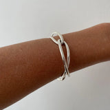 Ruddock-Soma-Bangle-Cuff-Interlocking-Interwoven-Tublar-Scultpural-twisted-clean-lines-forms-modern-statement-bracelet-Sleek-minimal-cool-jewellery-demifine-gold-plated-18ct