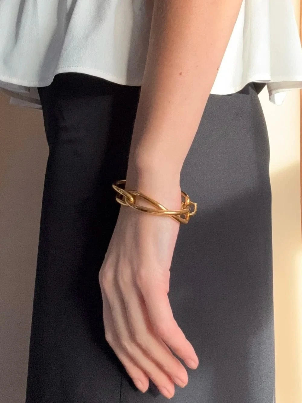 Ruddock-Soma-Bangle-Cuff-Interlocking-Interwoven-Tublar-Scultpural-twisted-clean-lines-forms-modern-statement-bracelet-Sleek-minimal-cool-jewellery-demifine-gold-plated-18ct