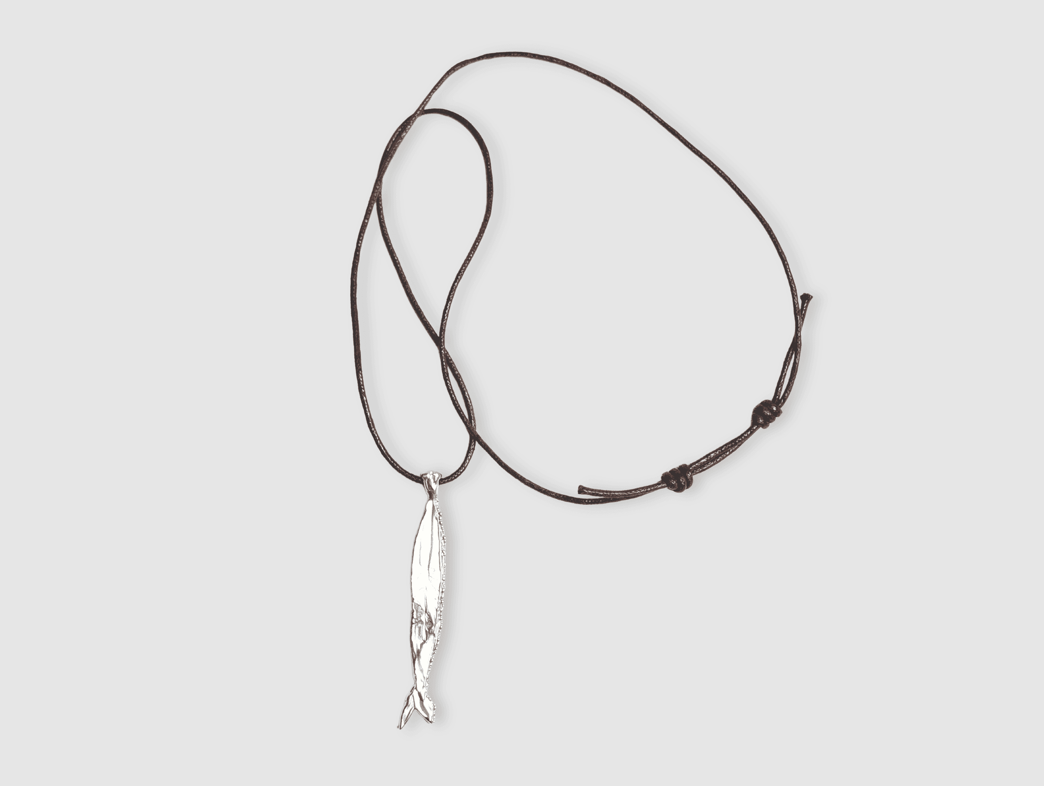 Milly-Maunder-Fish-Pendant-Long-Brown-Cord-Rope-2026-Trends-Necklace-Coastal-Marine-Motifs-Jewellery-Beach-Summer-Pendant-Sealife-Ocean-Textured-Cool-Pisces-Sterling-Silver