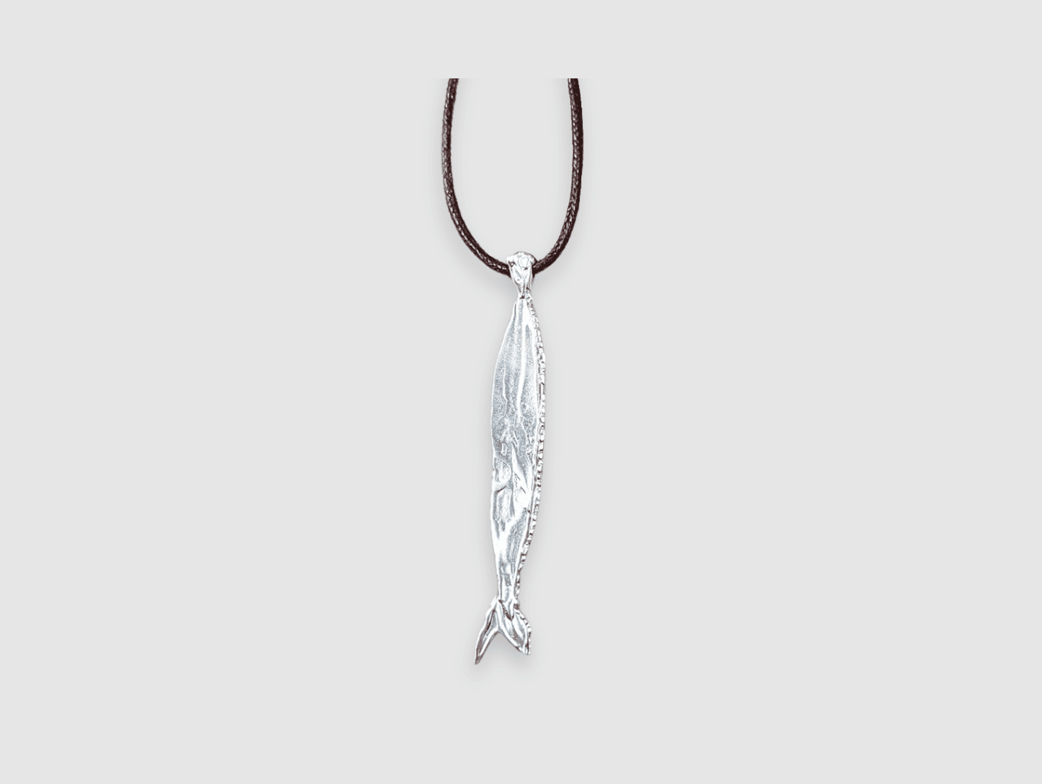 Milly-Maunder-Fish-Pendant-Long-Brown-Cord-Rope-2026-Trends-Necklace-Coastal-Marine-Motifs-Jewellery-Beach-Summer-Pendant-Sealife-Ocean-Textured-Cool-Pisces-Sterling-Silver