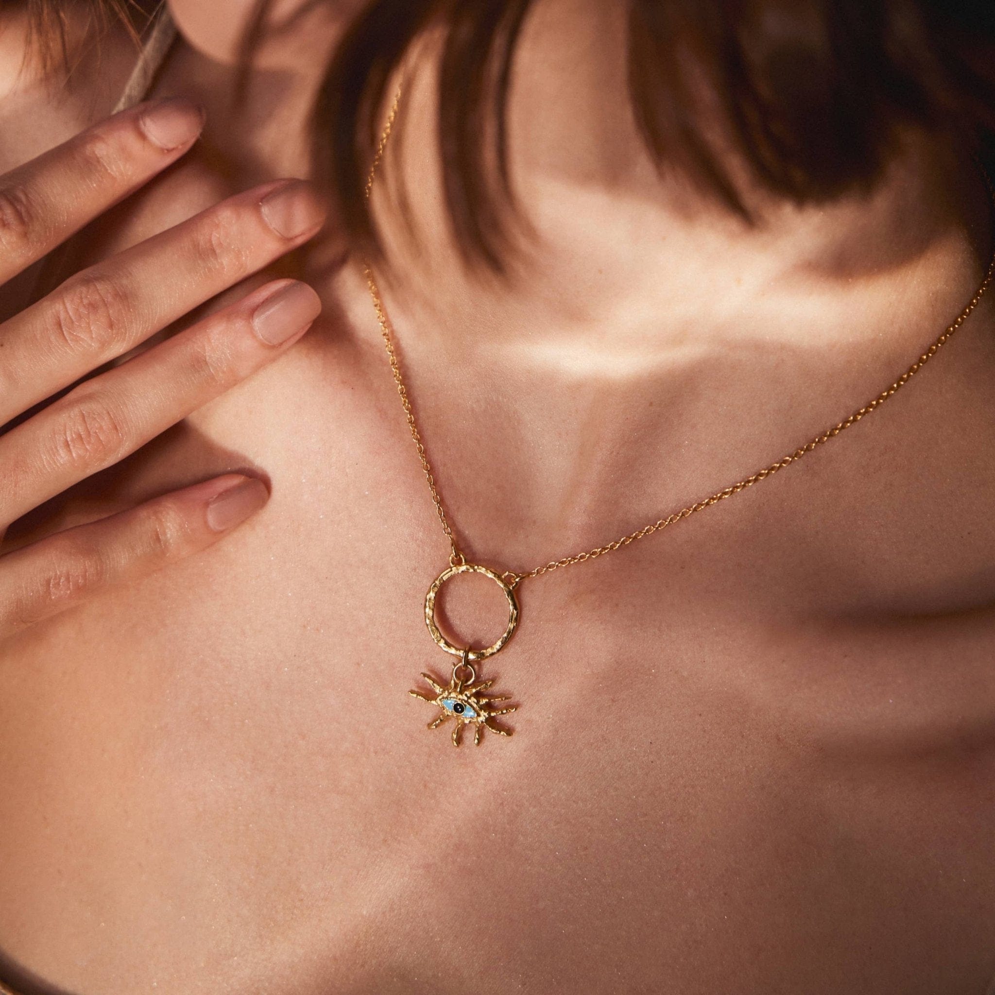 The Guardian Eye Charm-18ct-gold-vermeil-hammered-pendant-blue-boho-cool-summer-winter-sun-jewellery-interchangeable-charm-mix-match-gift-Kensho-Heirlooms-Meaingful-symbols-handmade-jewellery-goldenCharms-Kensho Heirlooms-GOLDEN-ShopGolden.co-Demifine-Jewellery-Destination-Contemporary-Curated-UK-Brands