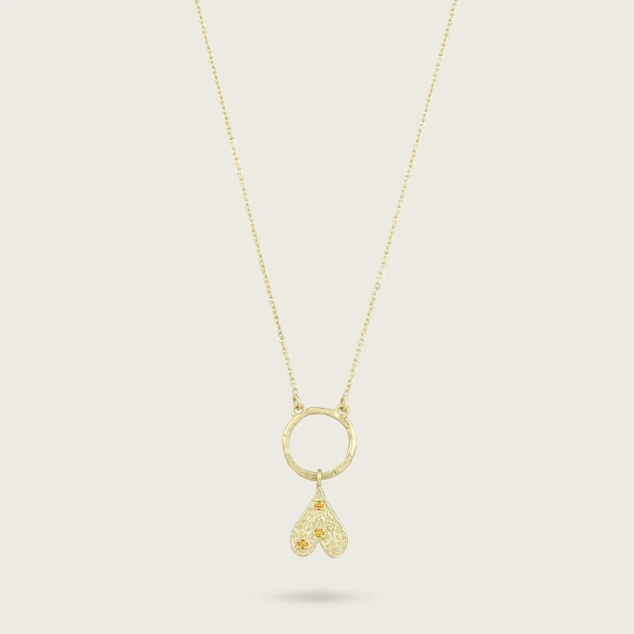 The Origins of Love Gold Charm-heart-citrine-stone-yellow-hammered-pendant-gold-vermeil-cool-boho-interchangable-mix-match-pendant-charm-necklace-layering-Kensho-Heirlooms-Summer-jewellery-handmade-uk-golden-brandsCharms-Kensho Heirlooms-GOLDEN-ShopGolden.co-Demifine-Jewellery-Destination-Contemporary-Curated-UK-Brands