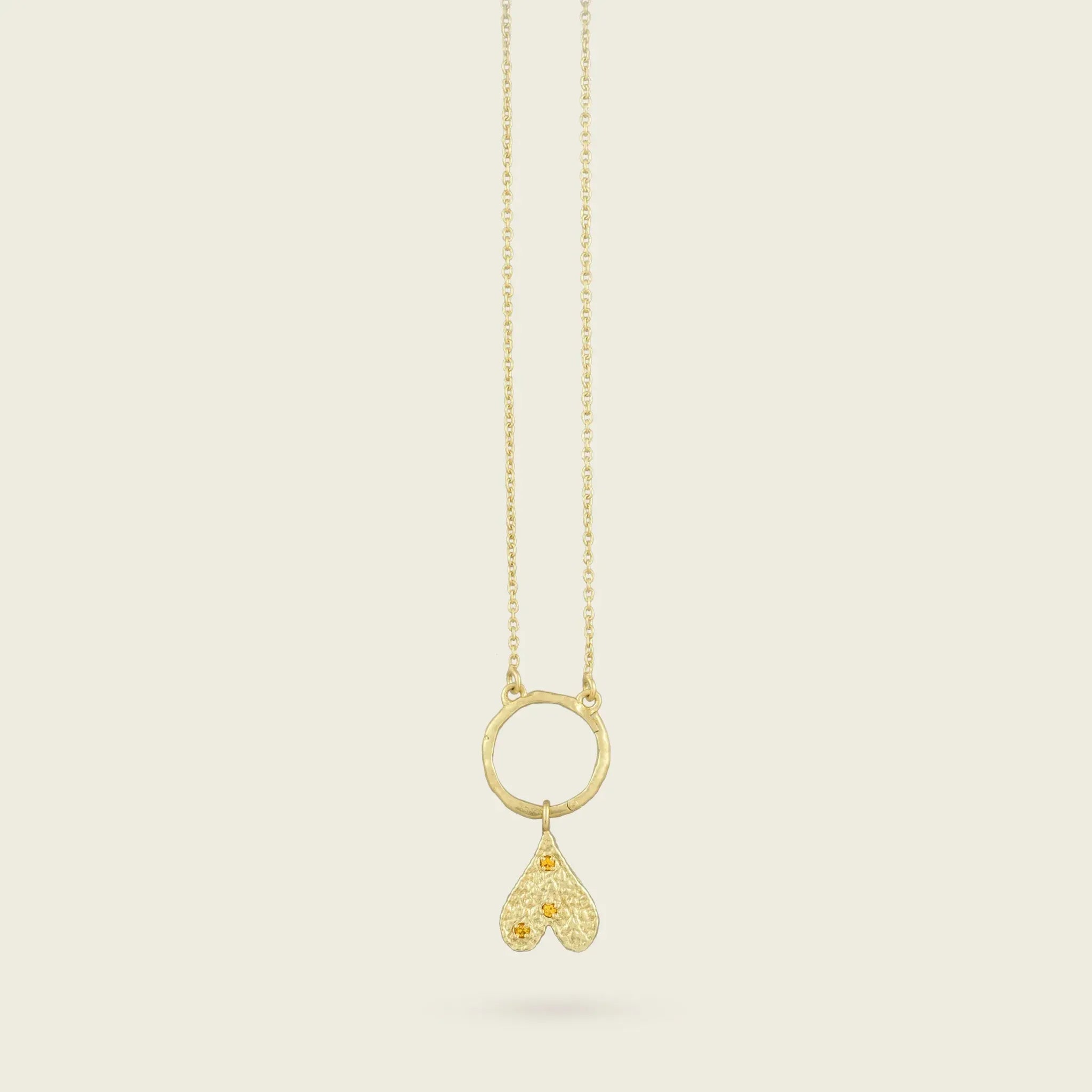 The Origins of Love Gold Charm-heart-citrine-stone-yellow-hammered-pendant-gold-vermeil-cool-boho-interchangable-mix-match-pendant-charm-necklace-layering-Kensho-Heirlooms-Summer-jewellery-handmade-uk-golden-brandsCharms-Kensho Heirlooms-GOLDEN-ShopGolden.co-Demifine-Jewellery-Destination-Contemporary-Curated-UK-Brands